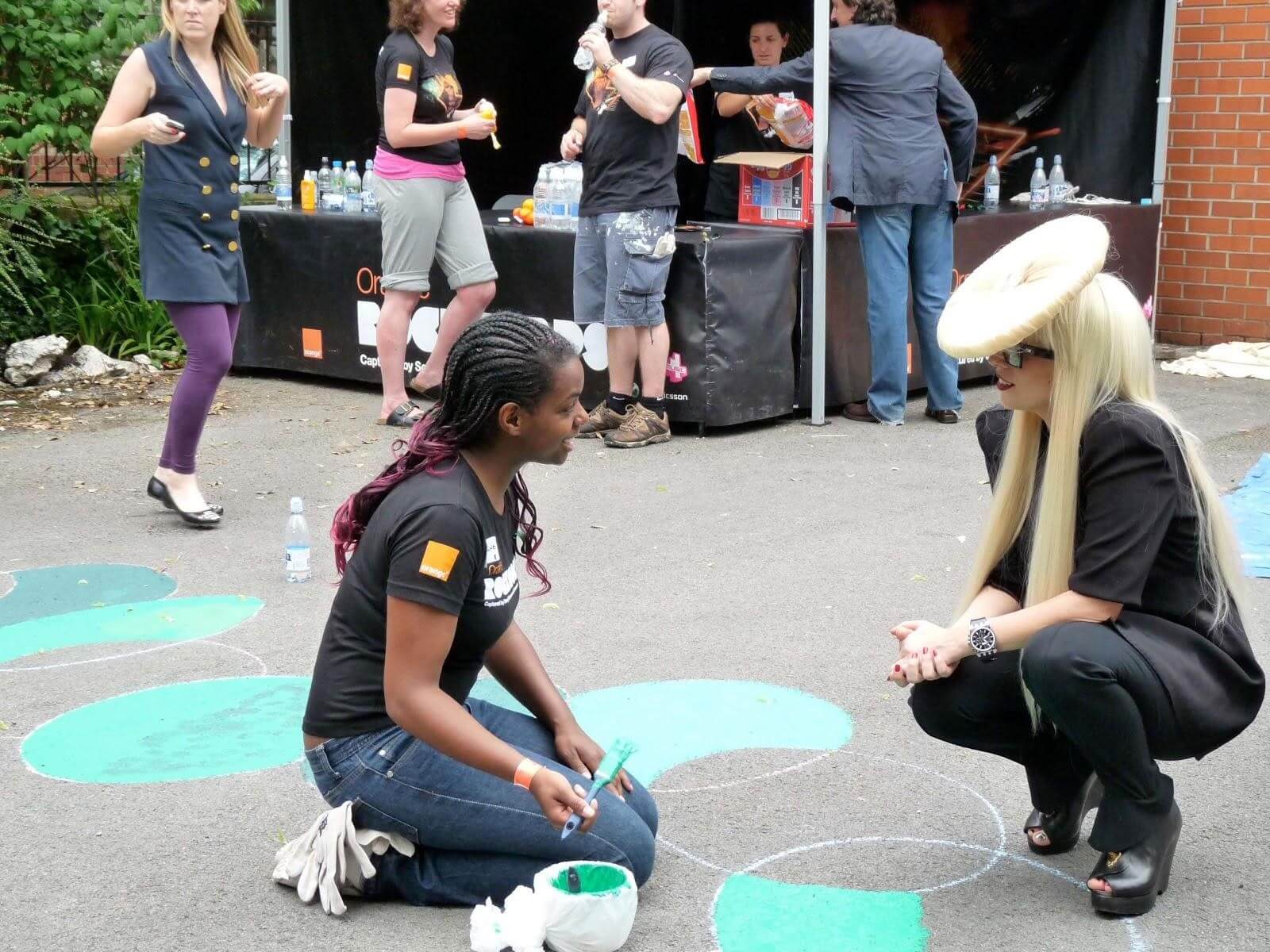 Lady Gaga with a young person on an Action Day